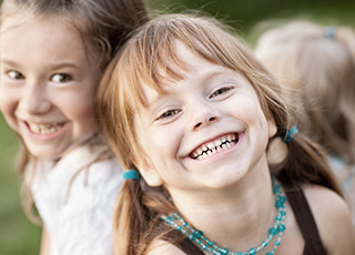 Two little girls smiling together